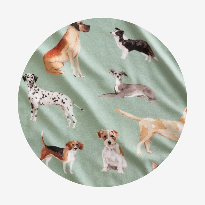 circle swatch of green bamboo viscose fabric with dog patterned print