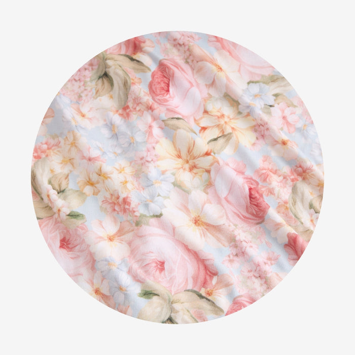 Floral patterned fabric with pink and white flowers on a light background