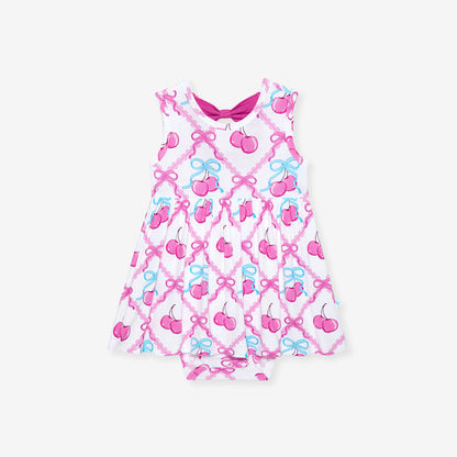Baby romper with cherry and bow pattern on a white background