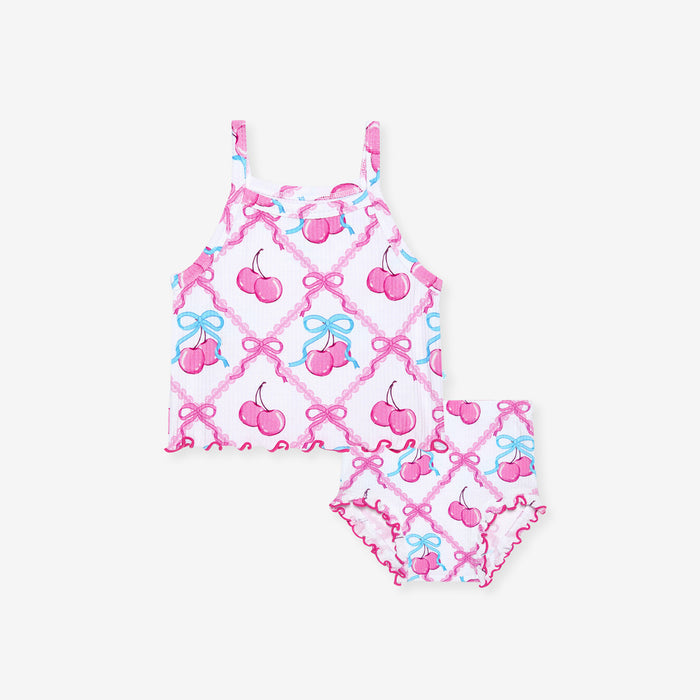 Pink children's bummie set with cherry and bow pattern on a white background
