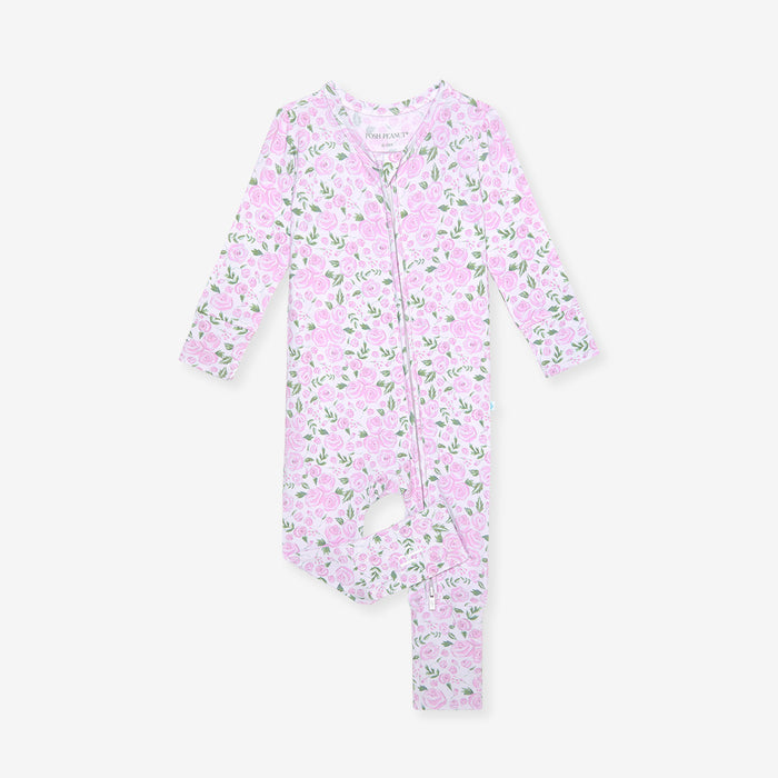 Pink baby onesie with floral pattern on a white background