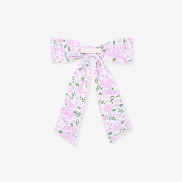 back detail of rose printed hair bow on a white background