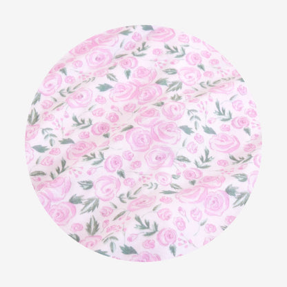 circle swatch of rose printed fabric close up