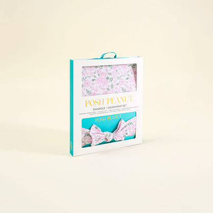 Posh Peanut swaddle and headband set packaging on a beige background