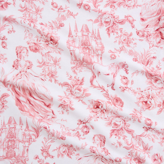 Pink floral and castle pattern on white fabric