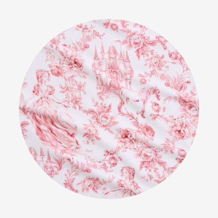 Round fabric swatch with pink floral pattern on white background
