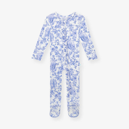 A blue and white floral patterned ruffled zippered footie one-piece for infants.