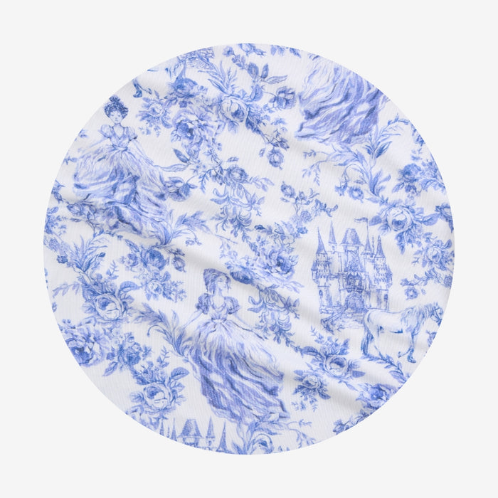 Round blue and white patterned fabric swatch on a white background