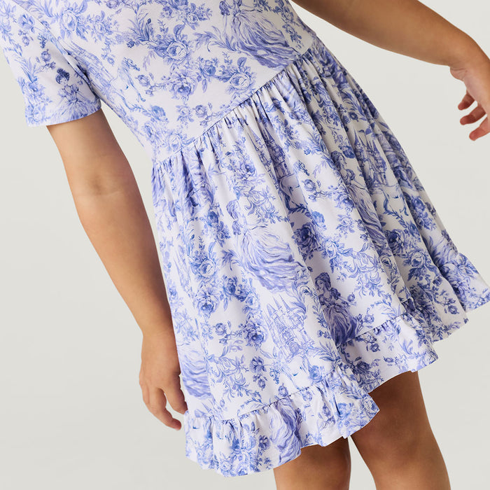 Close-up of blue and white floral dress on a plain background