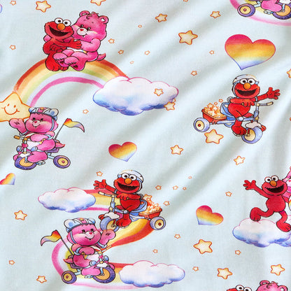 Children's fabric with Elmo and pink bear characters on a white background