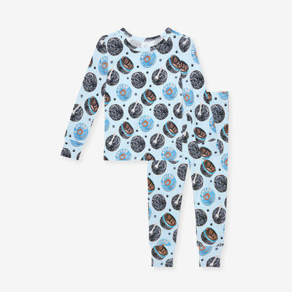 front image of children's one piece with caviar-themed print on a white background