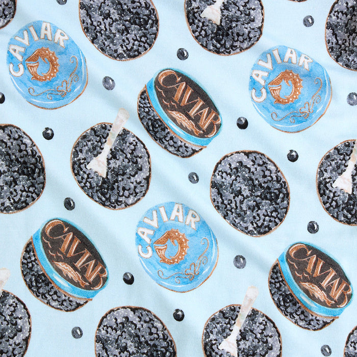 Close-up of caviar print with 'CAVIAR' text on a light blue background