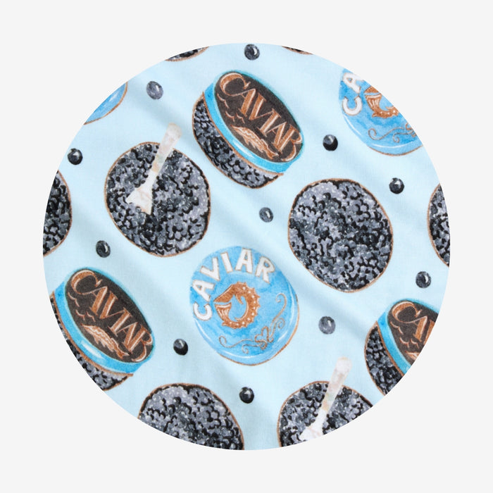 Round caviar fabric swatch on a light blue background