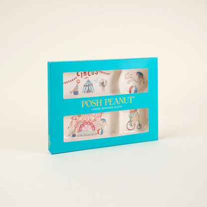 Posh Peanut plate set packaging with circus-themed illustrations on a light beige background