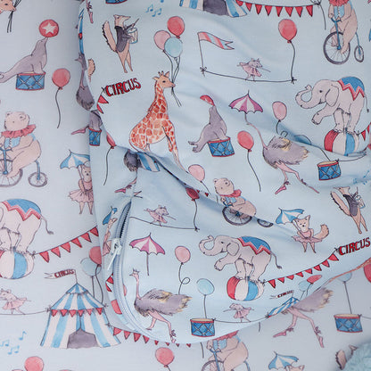 close up zipper detail of sleeveless sleep bag with circus print.