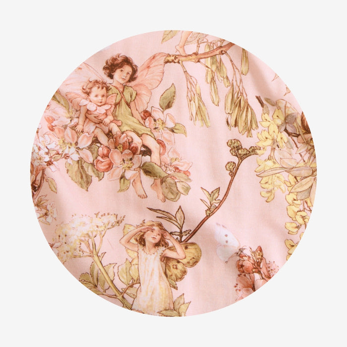 Circle swatch of pink fabric with flower fairies.