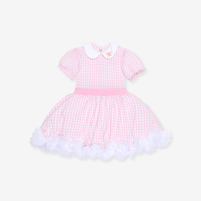 Pink checkered dress with white collar on a light beige background, front image