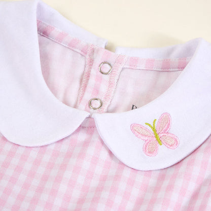 Close-up of bamboo viscose dress collar and button detail in pink gingham print