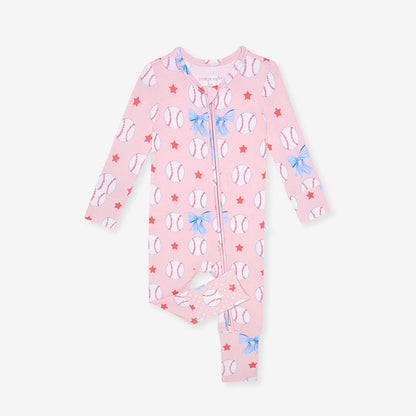 Pink baby one piece with baseball and bow tie pattern on a white background