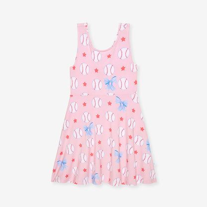 Pink dress with baseball and bow pattern on a white background