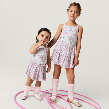 two girls in matching circus themed outfits