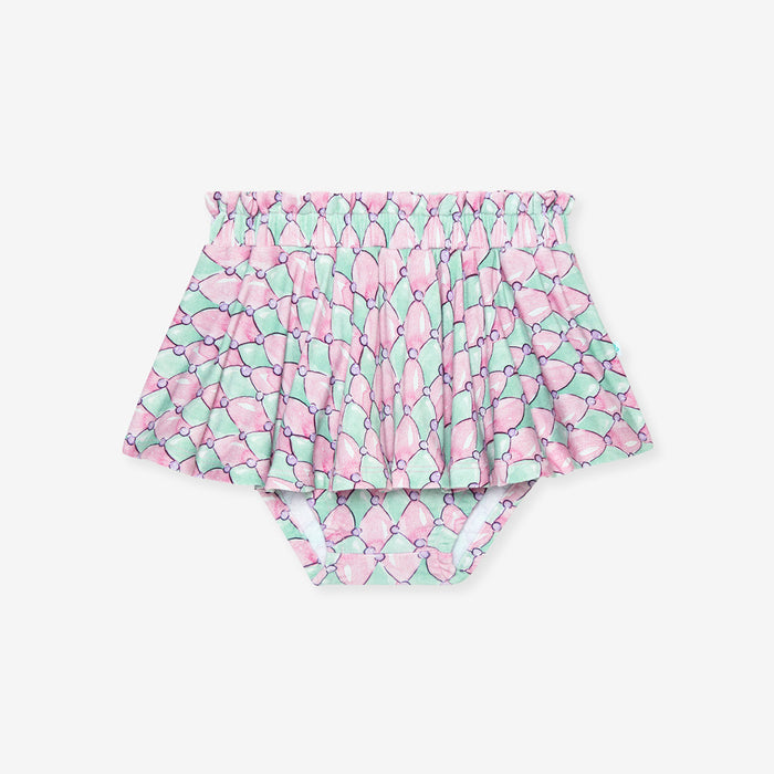 Pair of high-waisted bummie skirt with pink and green pattern on a white background