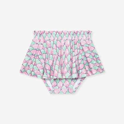 Pair of high-waisted bummie skirt with pink and green pattern on a white background