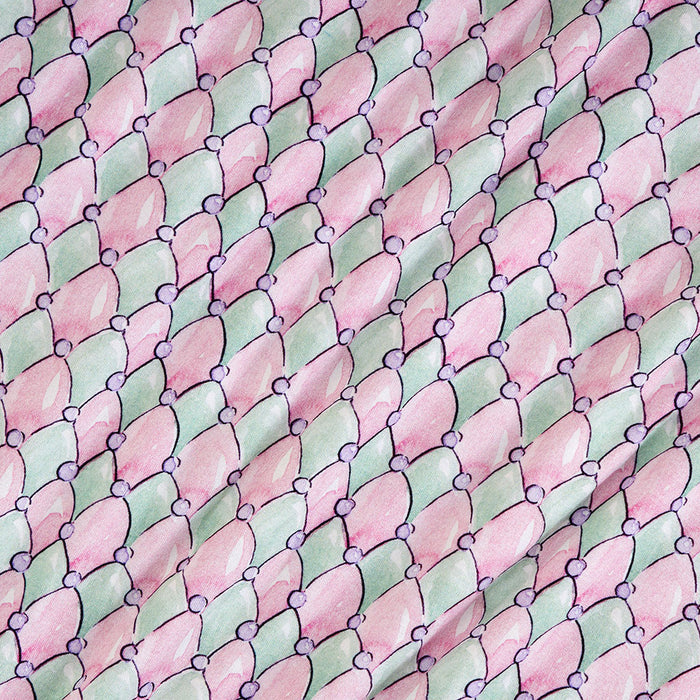 Pattern of pink and green diamonds with small purple circles on a textured background