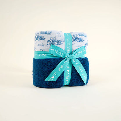 Blue towel with a green ribbon on a white background