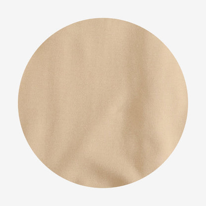 Beige circular fabric swatch on a light gray background
