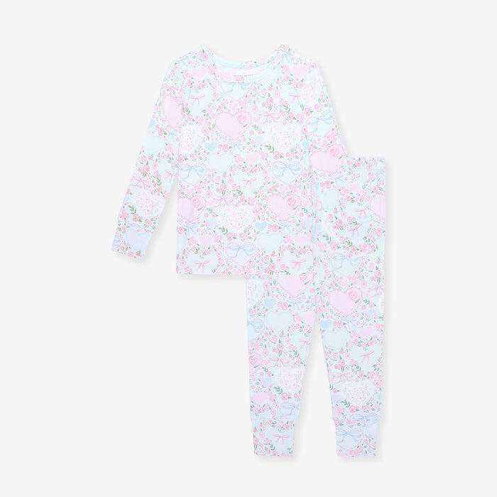 Floral-patterned baby one piece on a white background