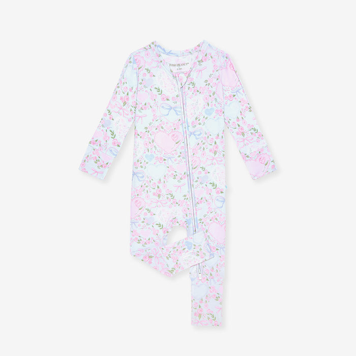 Floral-patterned baby one piece on a white background