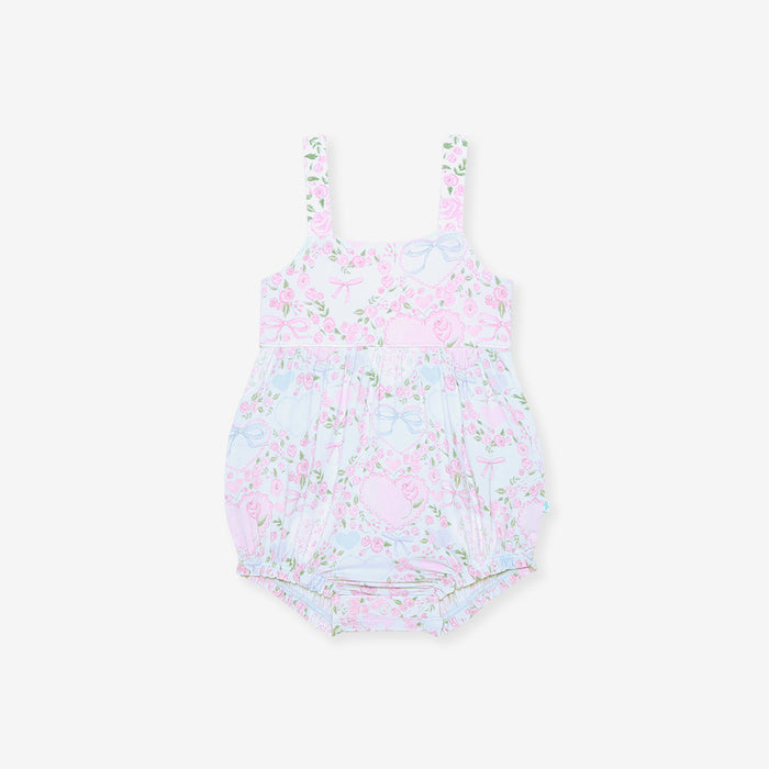 Floral-patterned baby romper on a white background