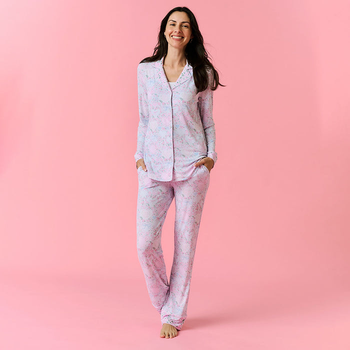 Woman wearing pink pajamas on a pink background