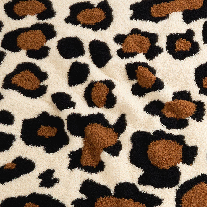 Leopard print pattern on a textured fabric background
