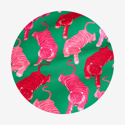 Pattern of pink tigers on a green background