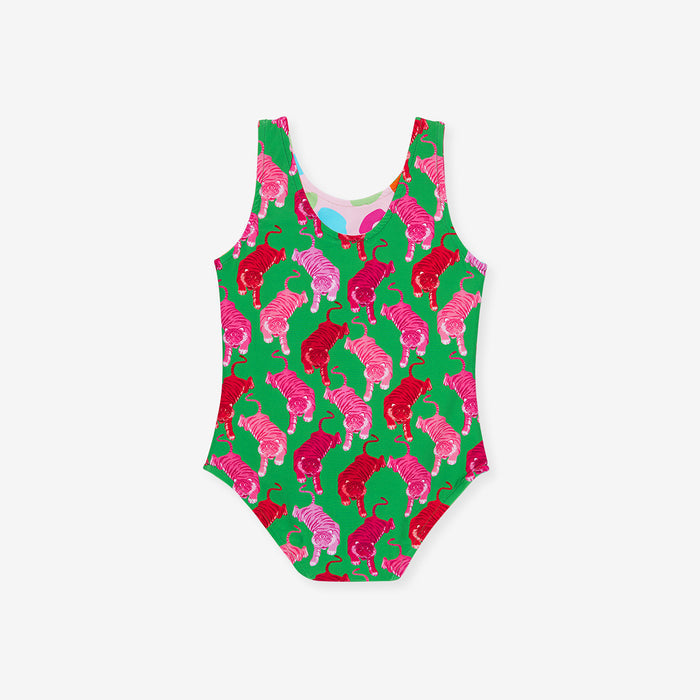 One-piece swimsuit with pink and red animal pattern on a green background