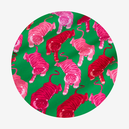 Pattern of pink and red tigers on a green background