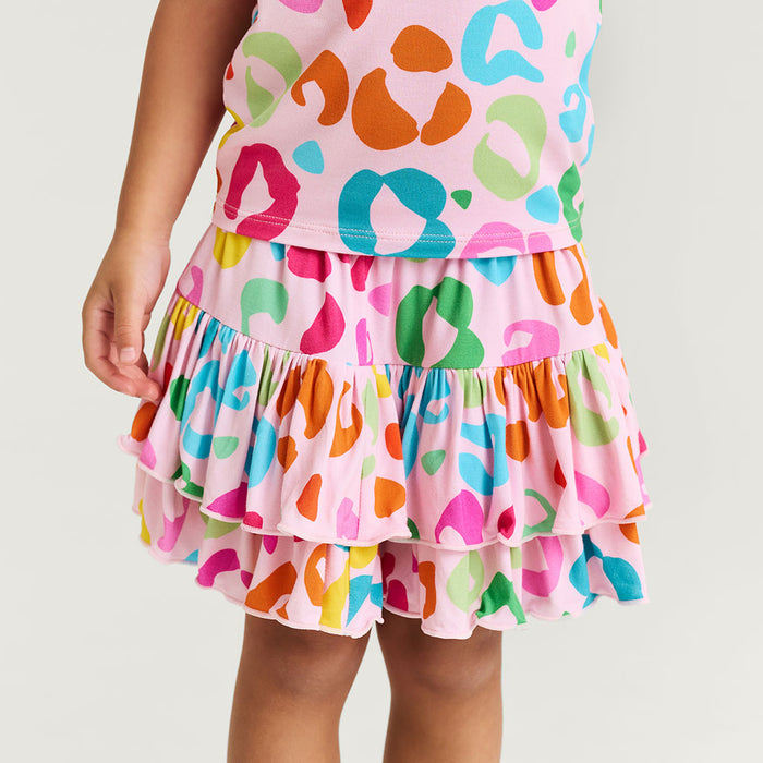 Colorful tiered skirt with multicolor pattern on a plain background