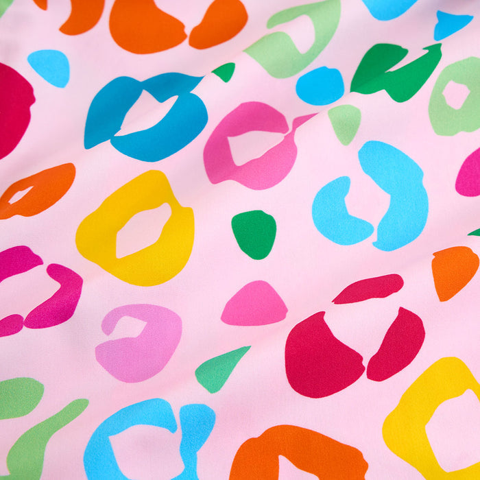 Colorful abstract pattern on a pink background