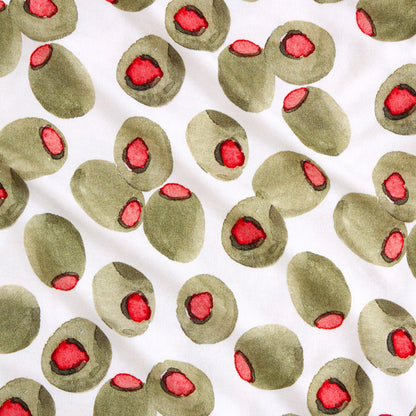 Pattern of green olives with red centers on a white background