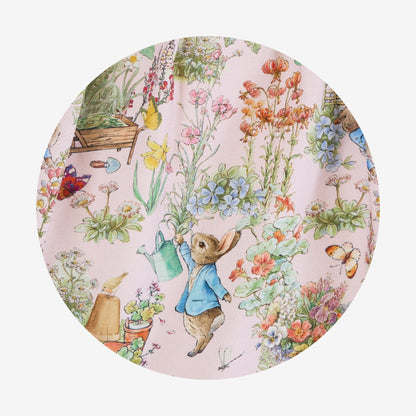 Round plate with a garden-themed design featuring a rabbit character and flowers.