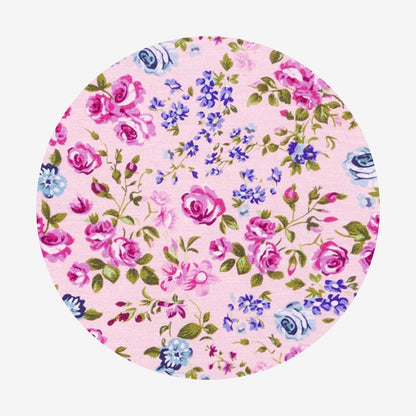 Floral-patterned round product on a pink background