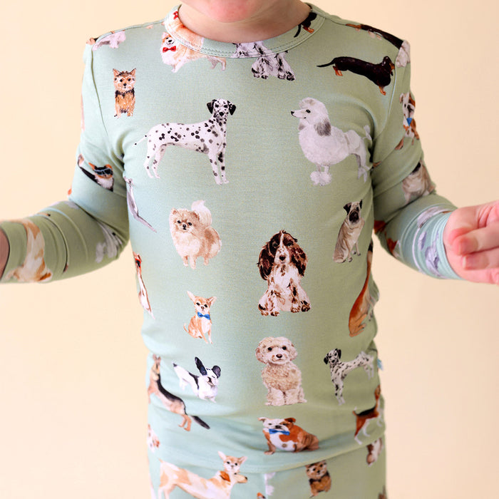 close-up of child wearing green dog patterned pajama set