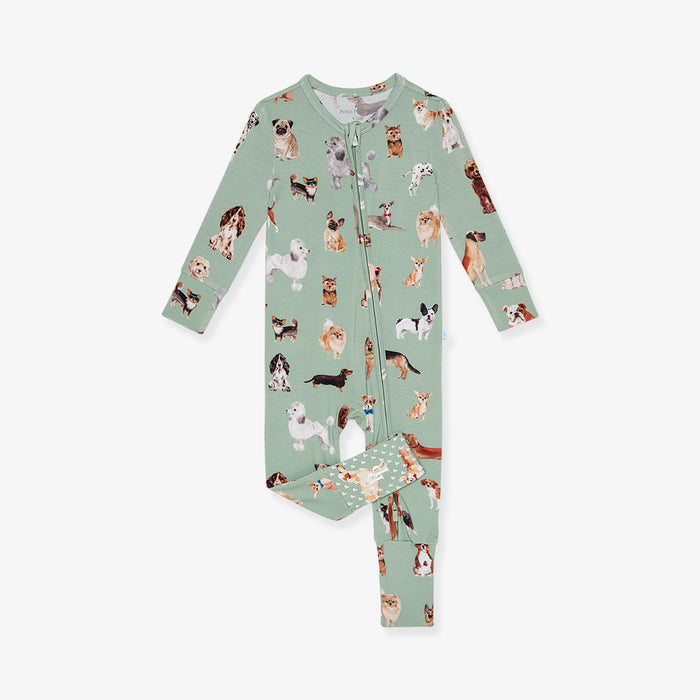 Children's one piece with dog pattern on a light green background