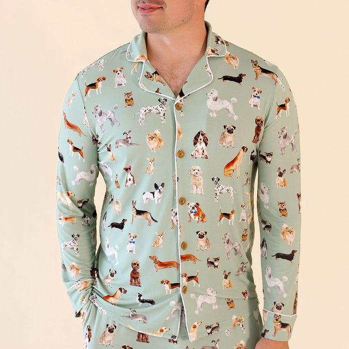 Light blue pajama set with dog pattern worn by a person on a beige background