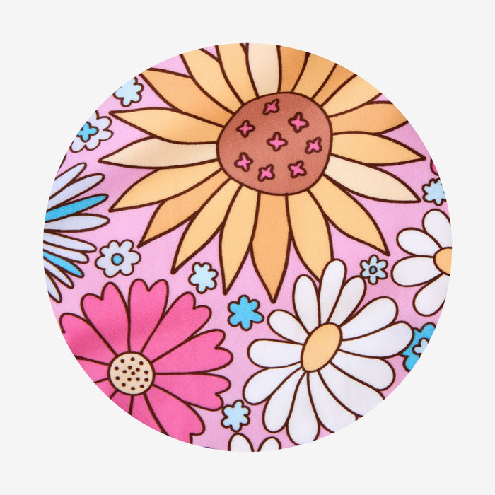Circular design with colorful flowers on a pink background