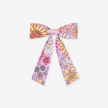 Floral patterned hair bow on a white background