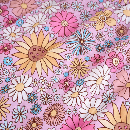 Colorful floral pattern on a pink background