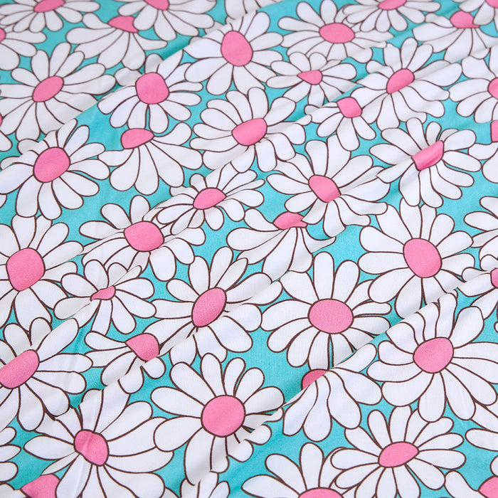 Pattern of white daisies with pink centers on a turquoise background